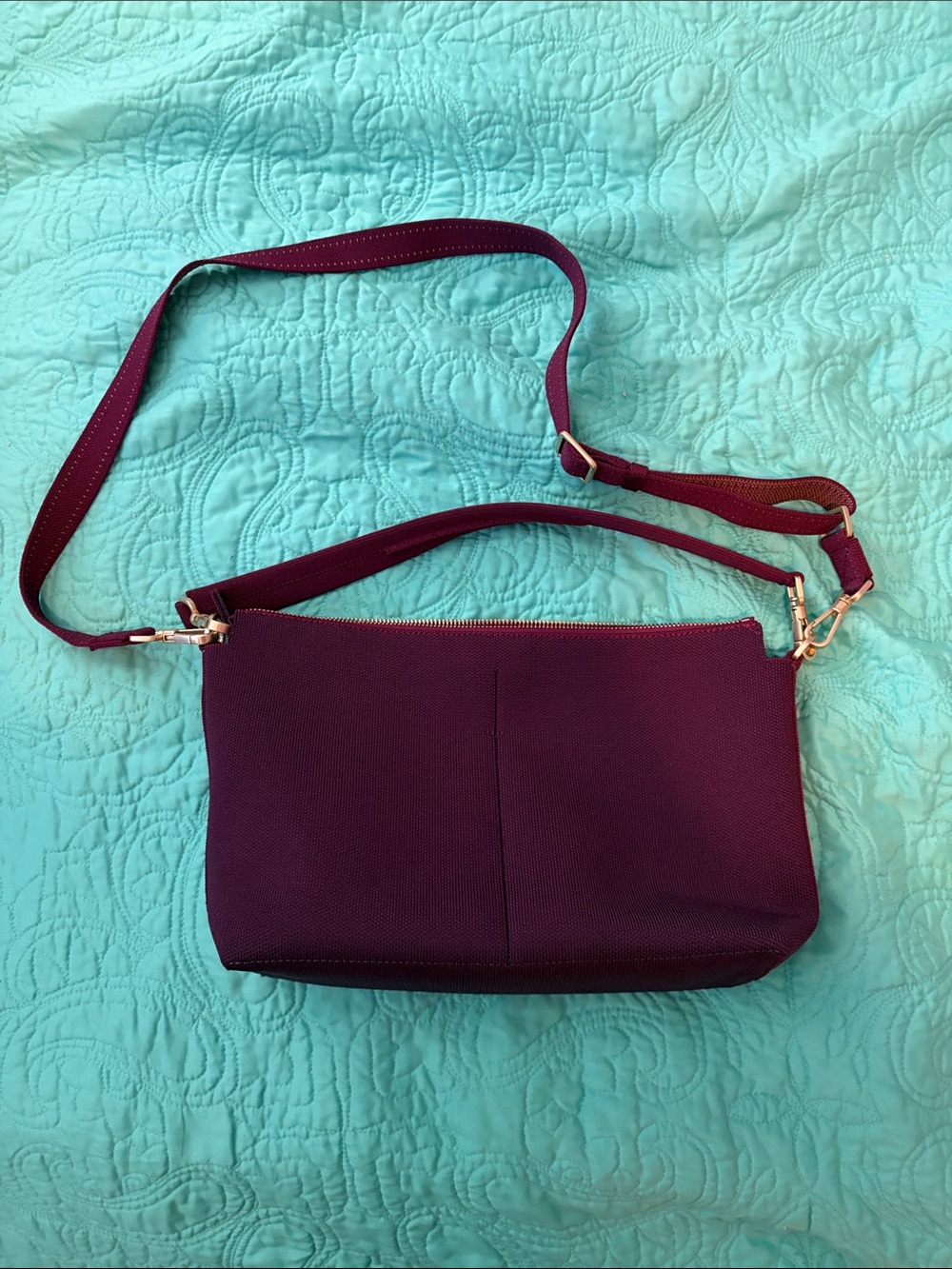 Rothy’s daily crossbody in dark aubergine